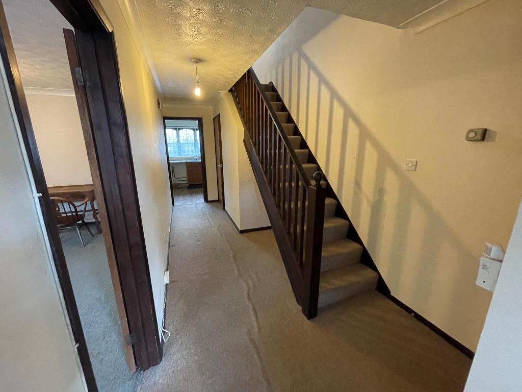 Lot: 135 - THREE-BEDROOM SEMI-DETACHED HOUSE FOR IMPROVEMENT - Hallway with access to living room and kitchen